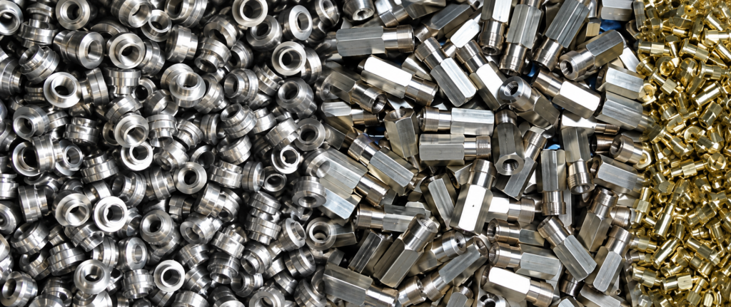 large pile of freshly washed industrial machined metal parts